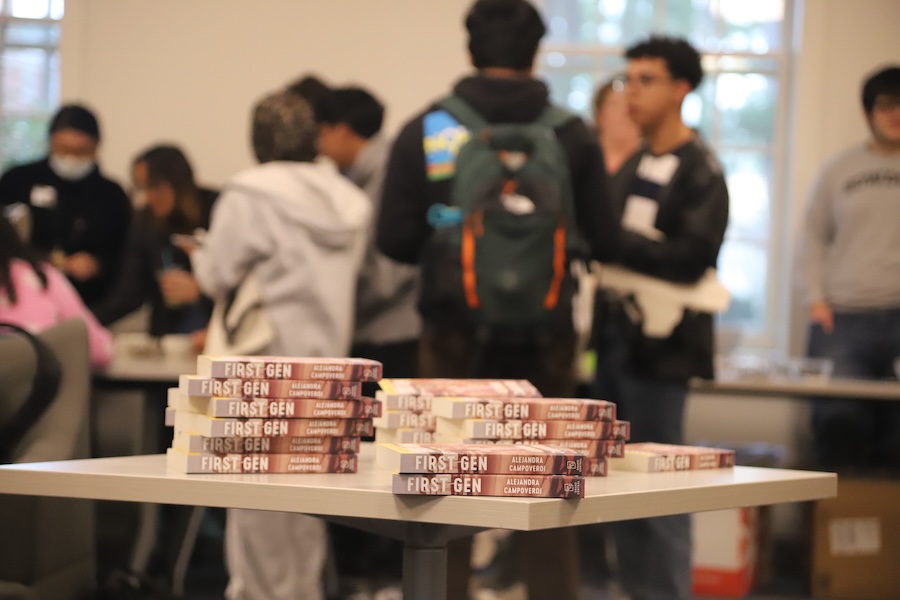 Students in front of a book being given away