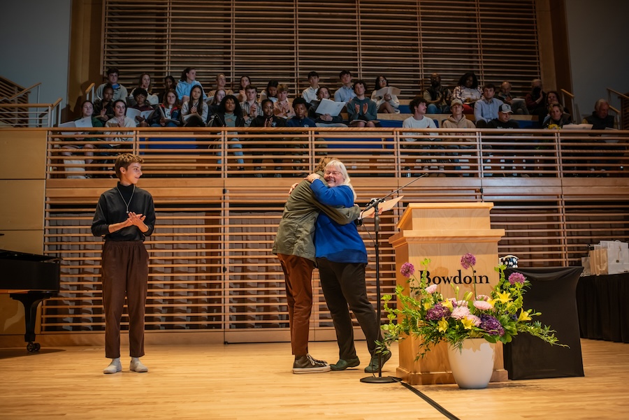 Tricia Welsch hugs a student