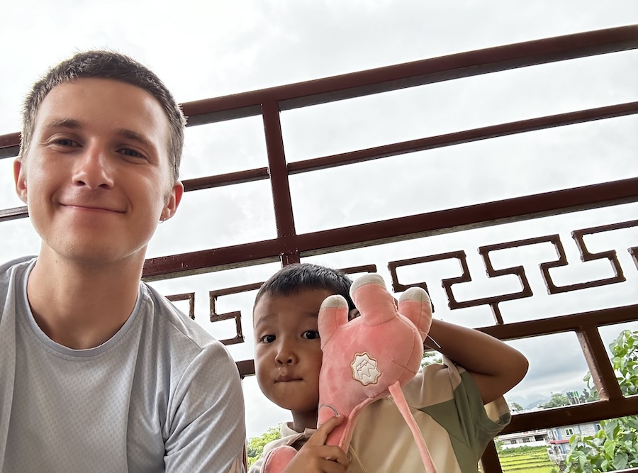 Jimmy with a child in Nepal