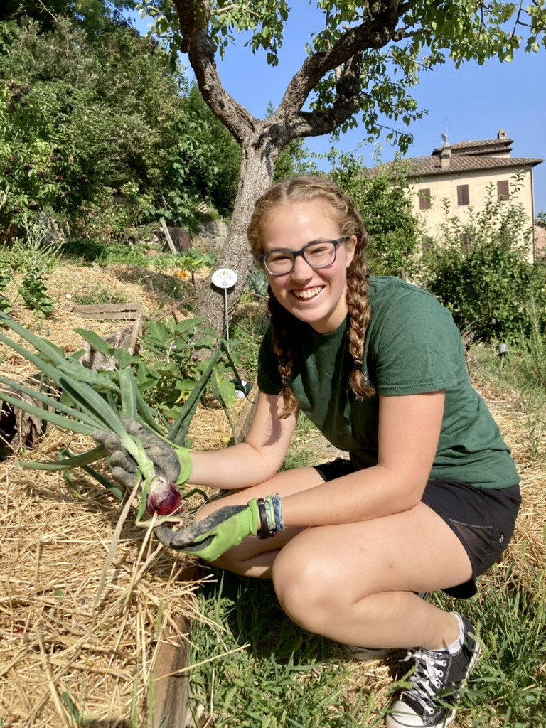 Katie Kurtz with leeks, in Italy