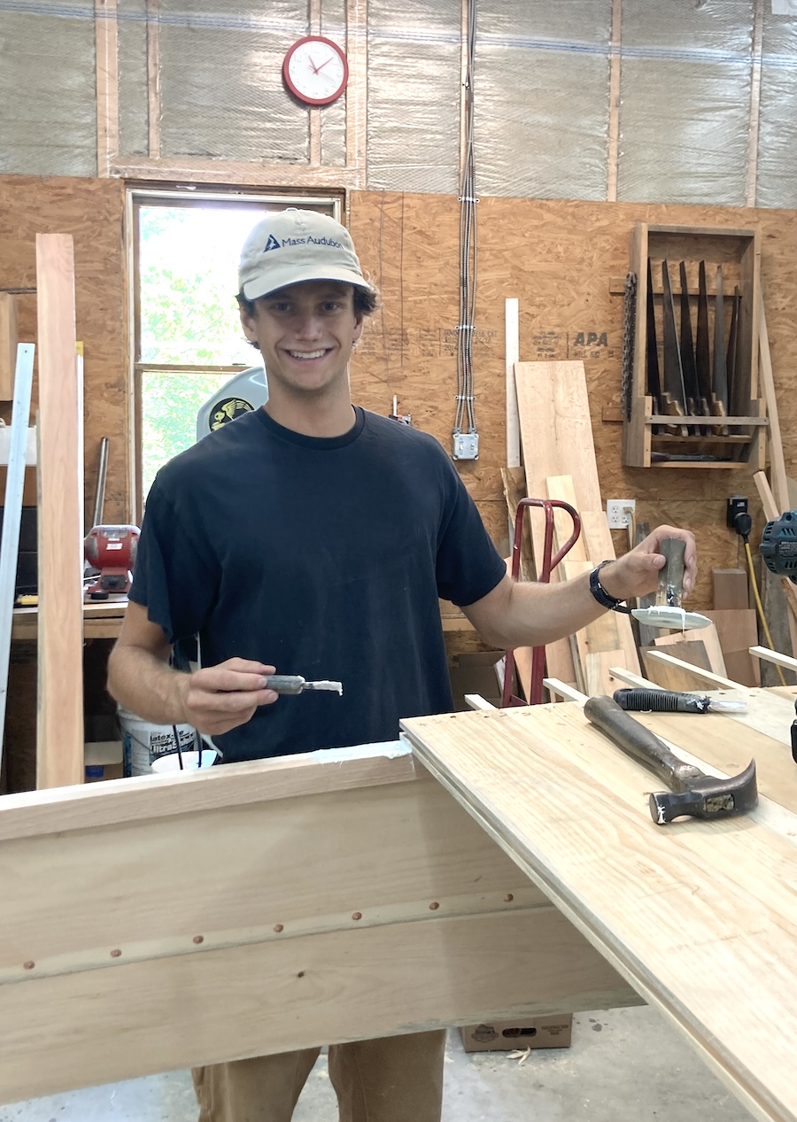 Liam at the boat building workshop