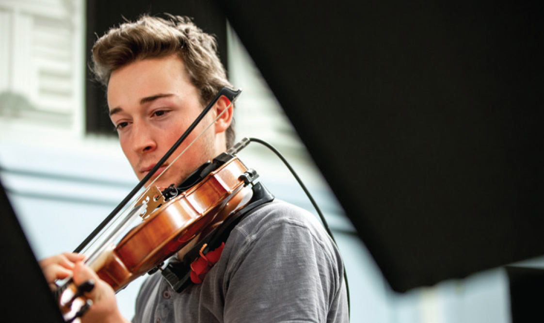 Finn Woodruff playing the fiddle.