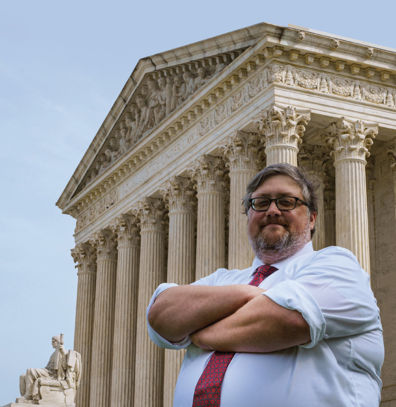 Luke Wilson '06 in front of the courthouse in a photo by Candice Kalb.