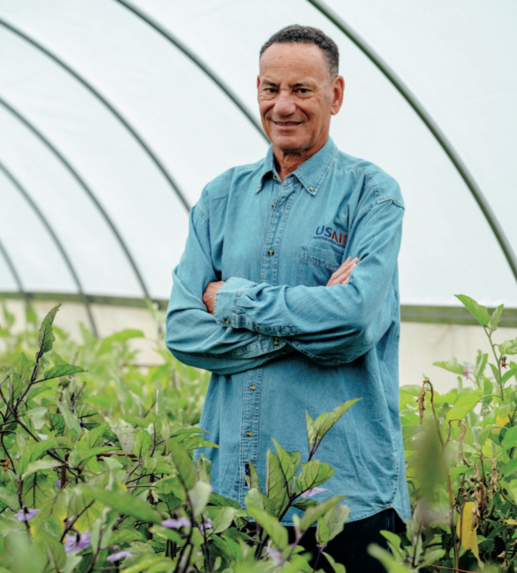John Bowman '76 in a greenhouse