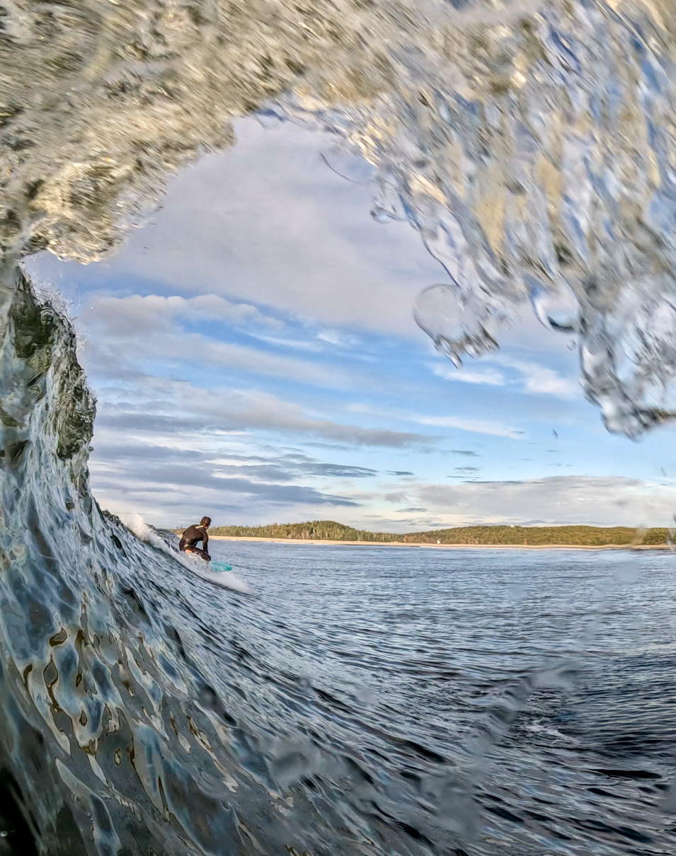 Caught in the curl, in a photo by Heather Perry.