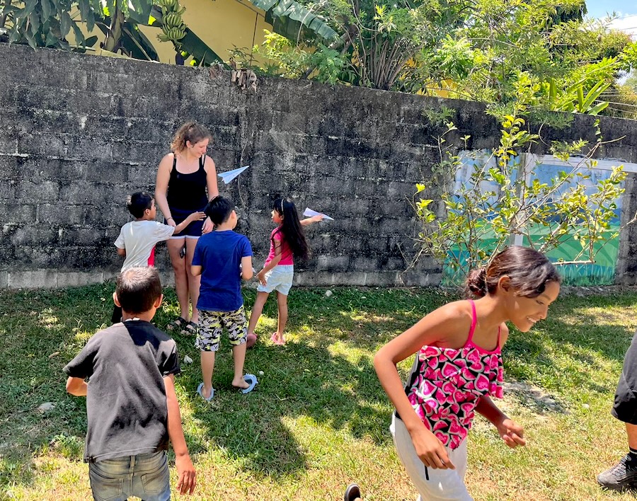 Mila playing with children