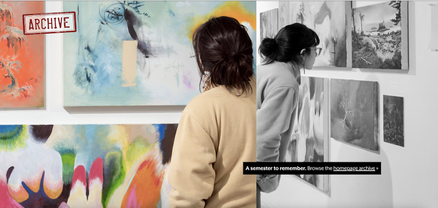 Student gazes at art during Visual Art's December open house.