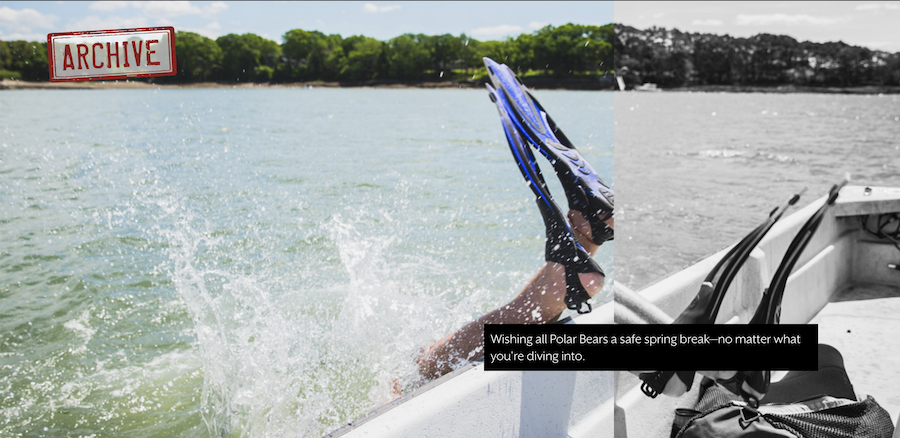 A student scuba diving flops backward into the ocean from a boat