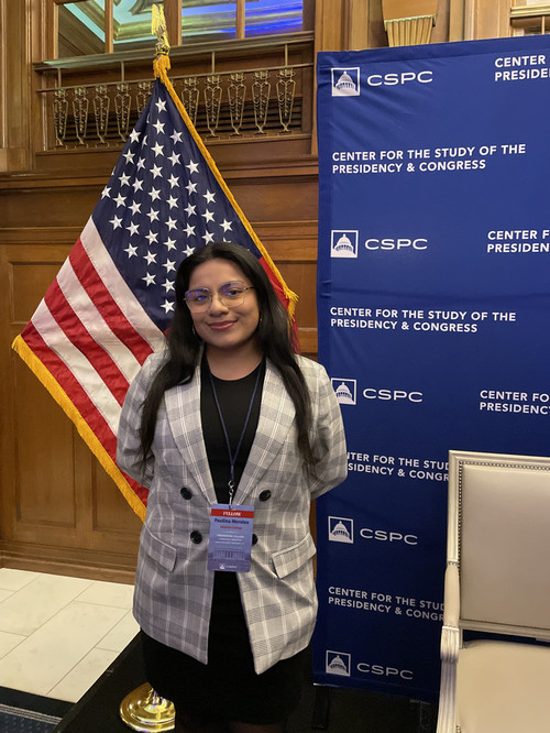 paulina morales in front of flag