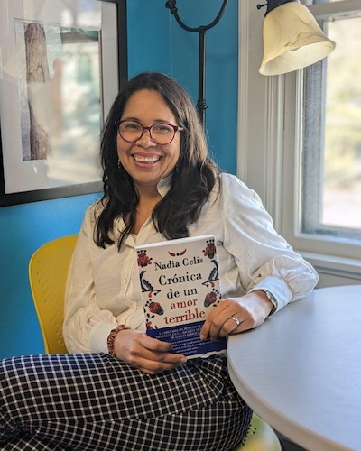 Nadia Celis with her book