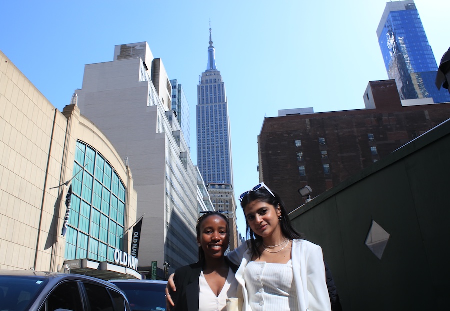 Students stand in front of Empire State Building 