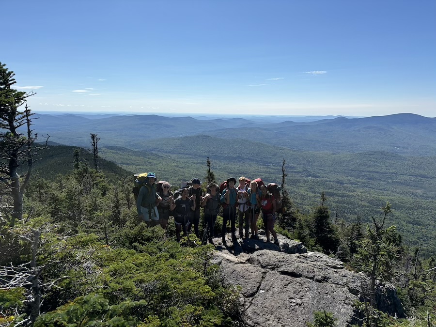 Orientation trip photo, group on a mountain ledge