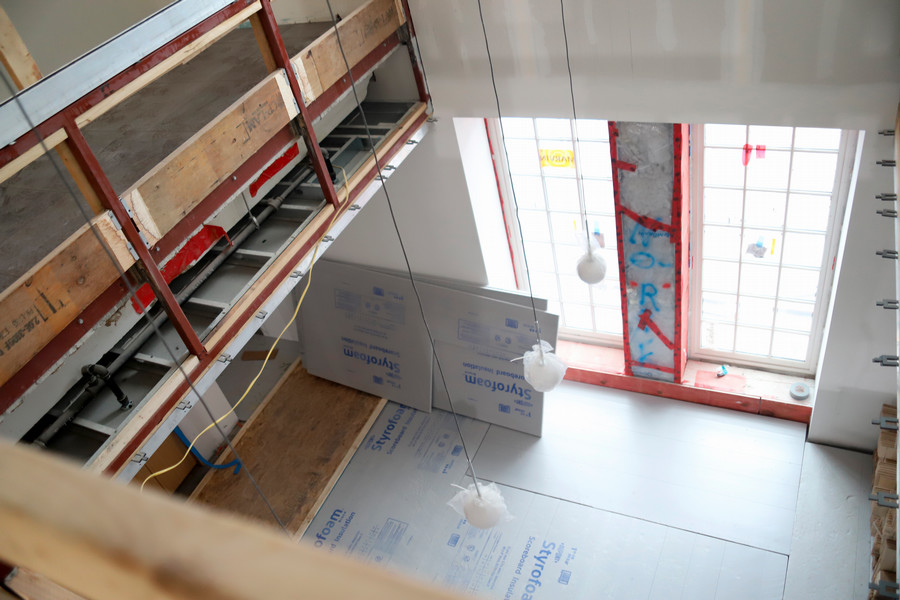 sills reno - View from first floor to lower level and windows at the new terrace