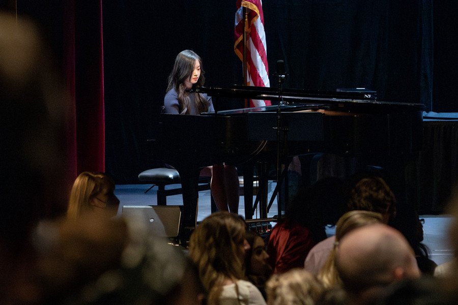 skyla hong plays piano at SJB day 2024