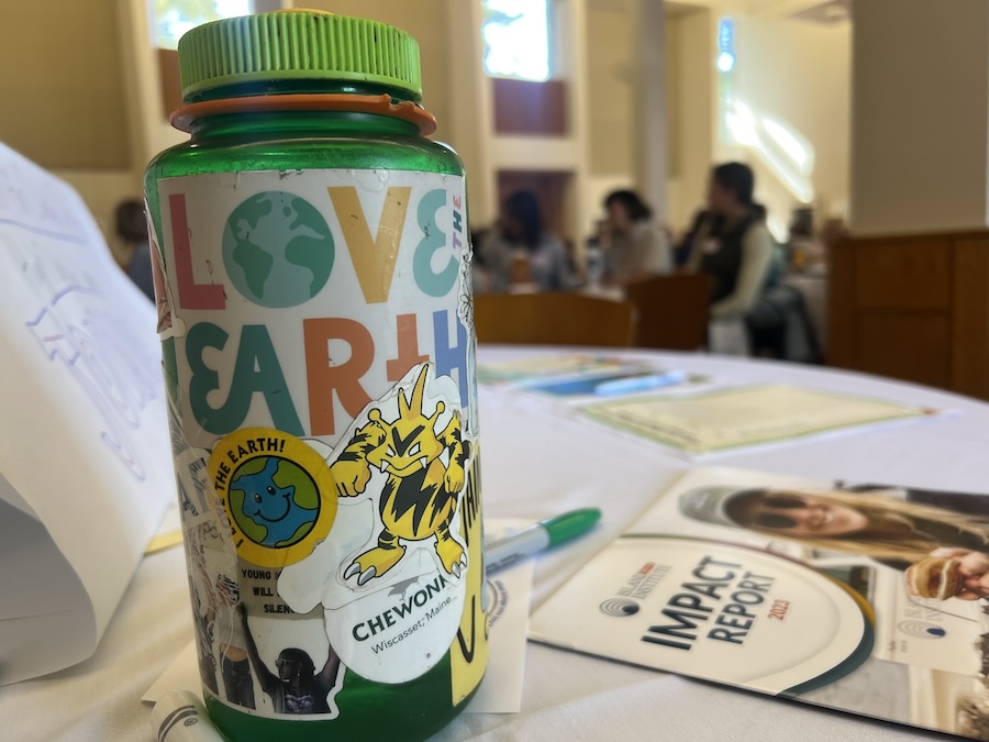 Water bottle with environmental sticker on it