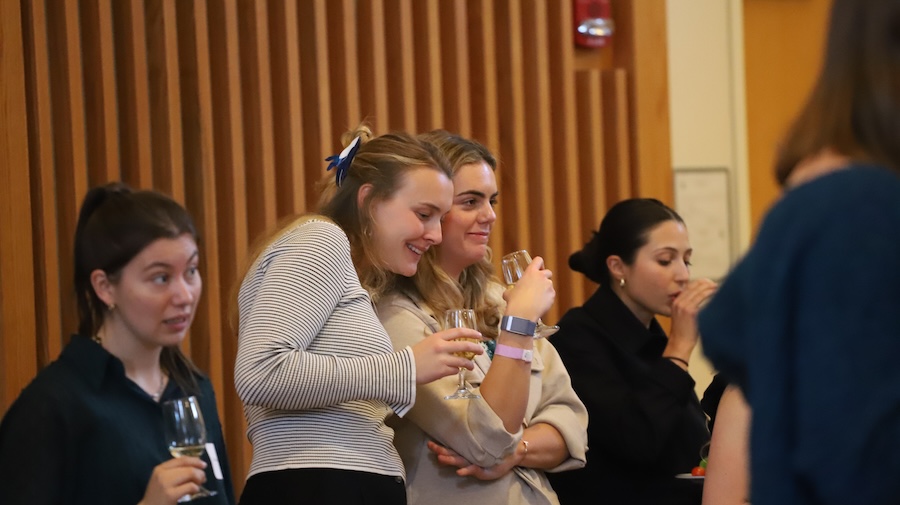 students hugging at the women's leadership summit