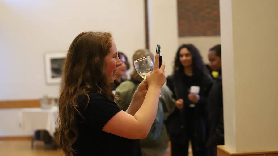 student photographing at the event