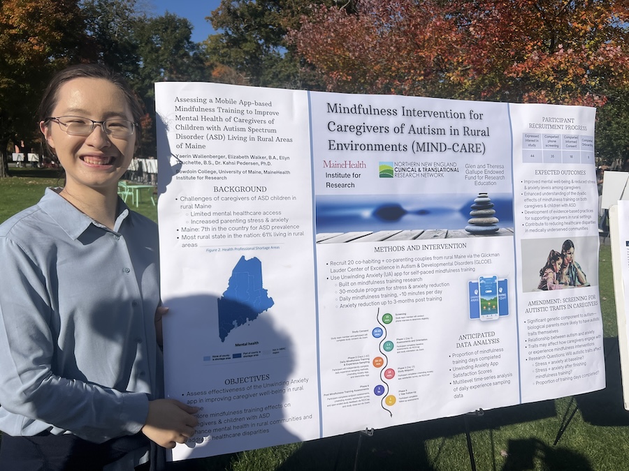 Yaerin in front of her poster