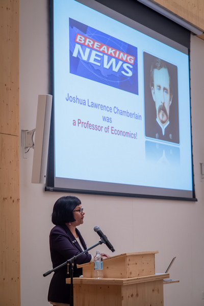 Prof. Khan at podium