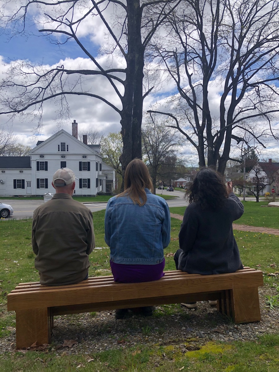 The podcasters on a bench at the James Weldon Johnson house in Wiscasset.