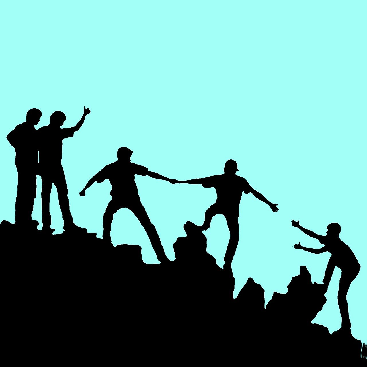 People climbing a mountain together