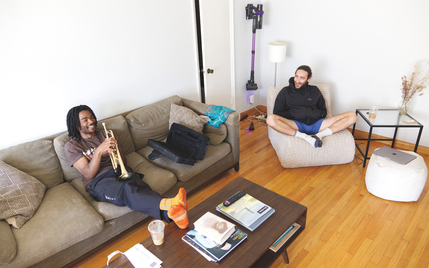 Omola and Laifer in their living room, before work.
