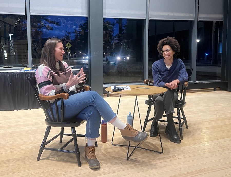 Maggie Thomas and Ayana Johnson chat about federal climate policy to an audience of students in the Roux Center for the Environment.