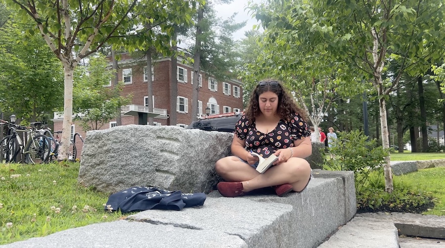 sofia reads her political theory on campus