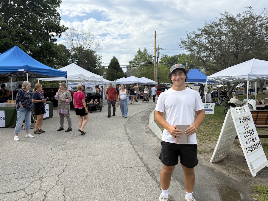 asher savel at a farmers market