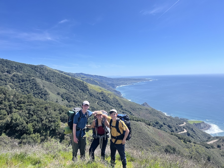 The three friends hiking together