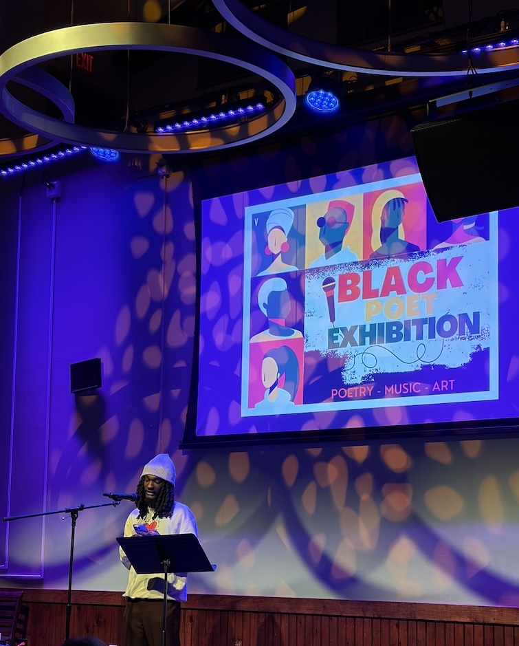 Anthony Bernier shares a poem at a poetry night