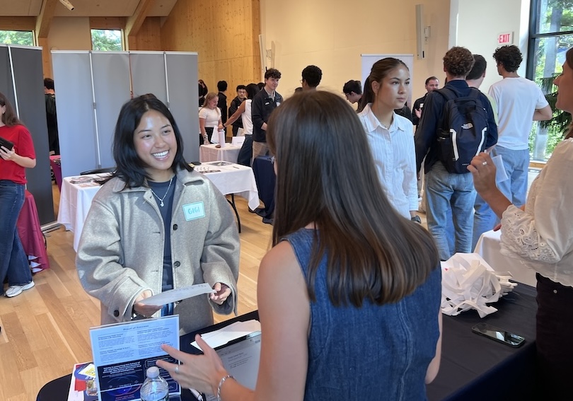 a student talks to a company rep
