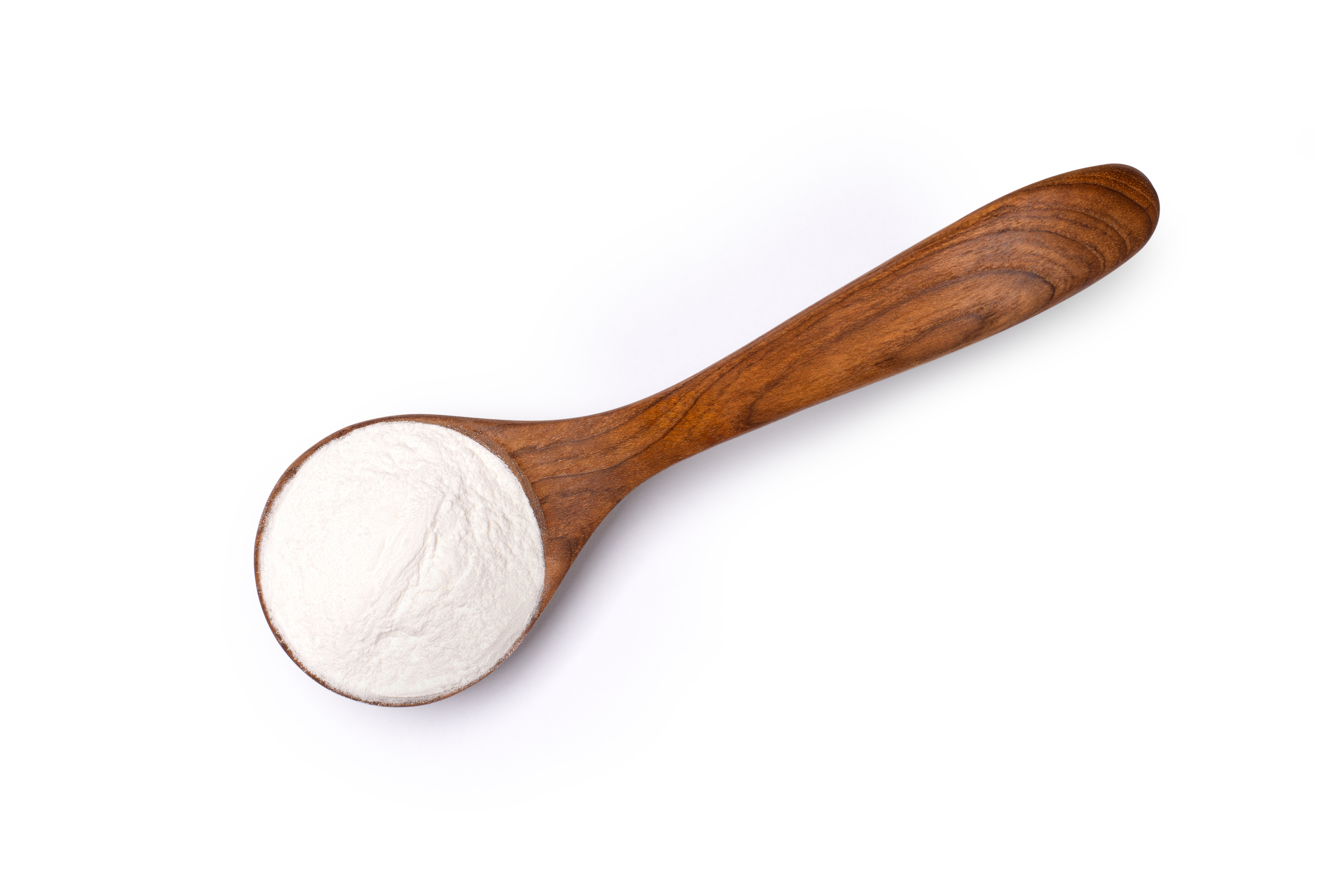 Wooden spoon of flour