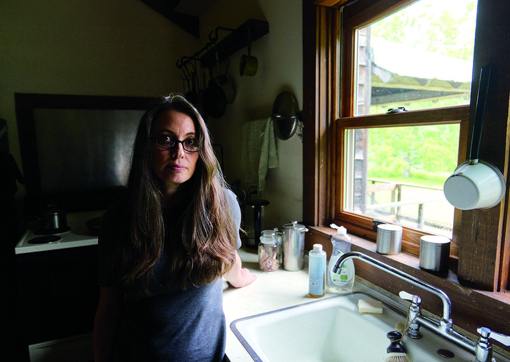 Kerney in the cabin’s kitchen. Photograph by Chris Ritter