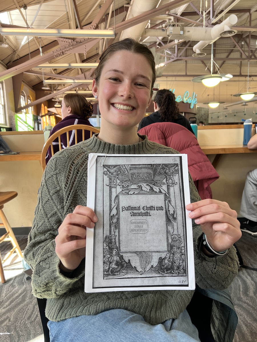 Frances Trafton with her printed copy of “Passional Christi und Antichristi.”