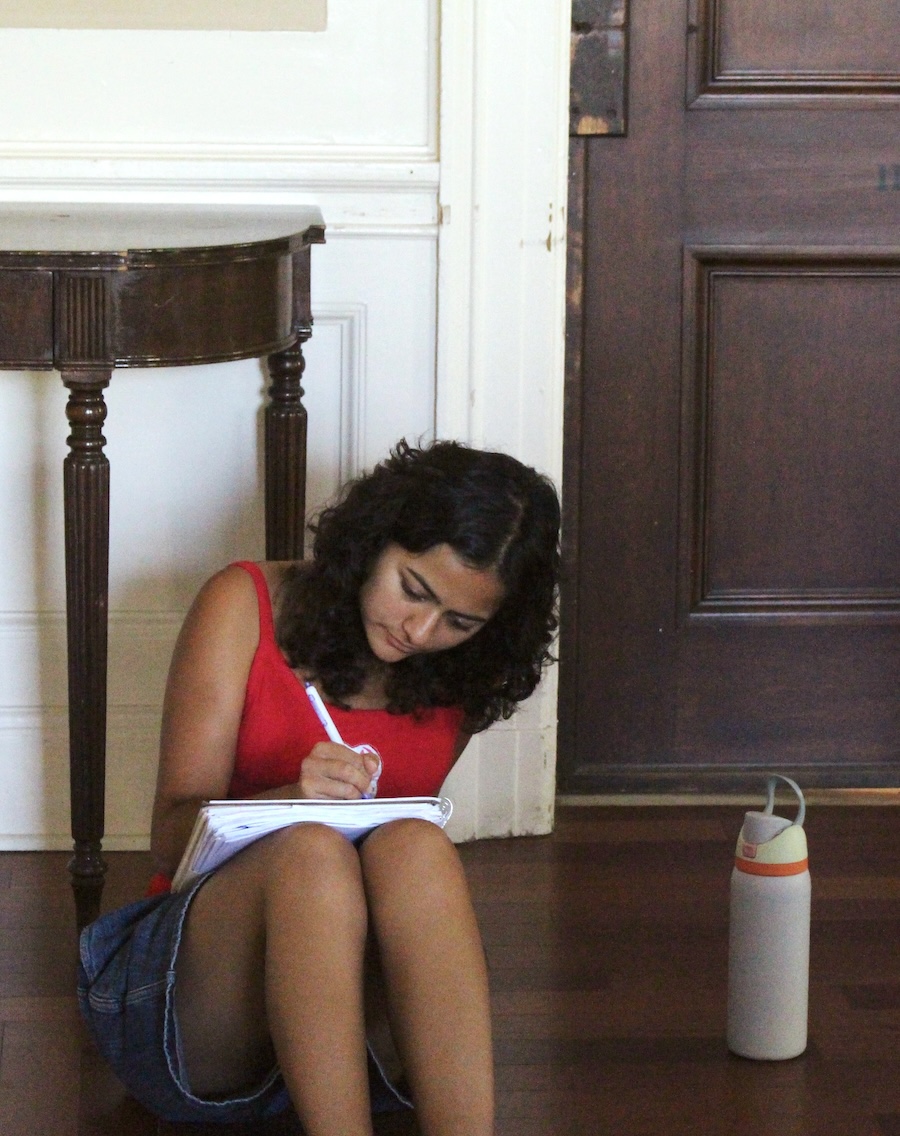 Student writing in a workshop