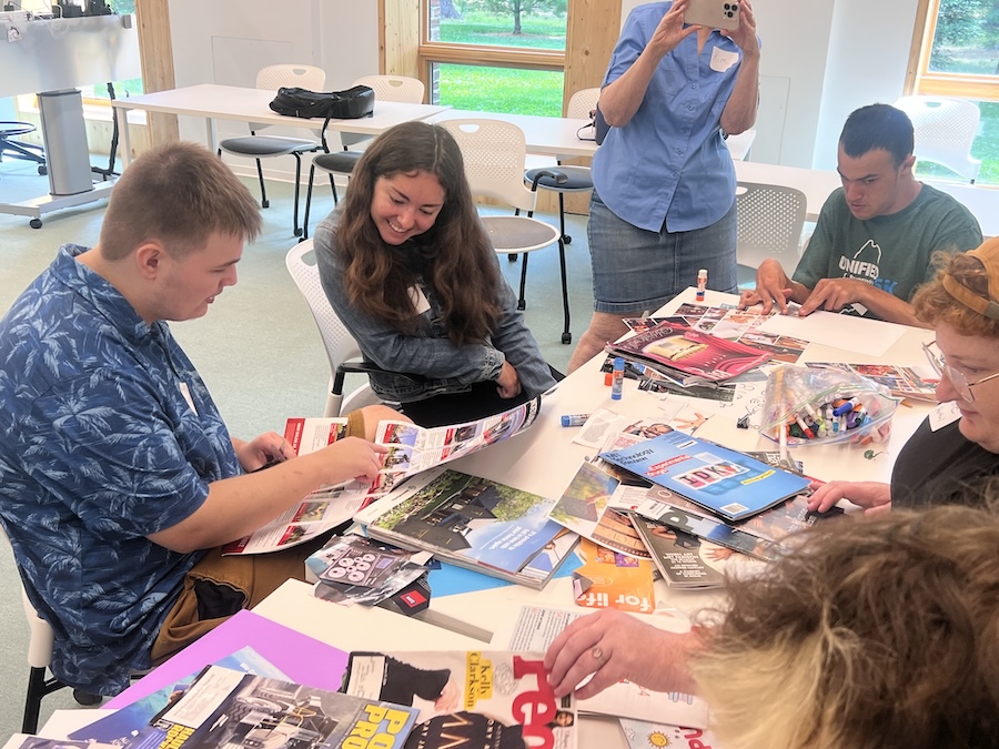 Libby Riggs with Harrison, at table with magazines