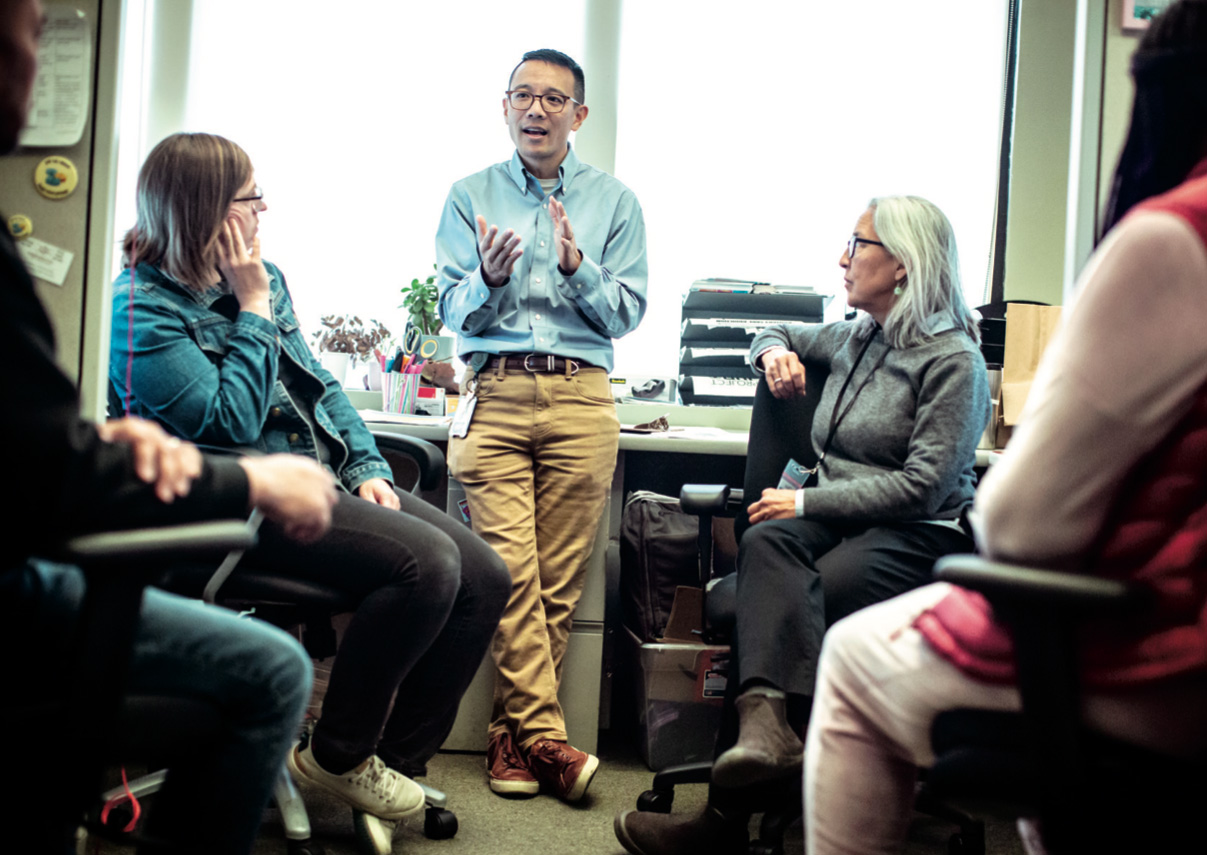 Dr. Hom in a team meeting