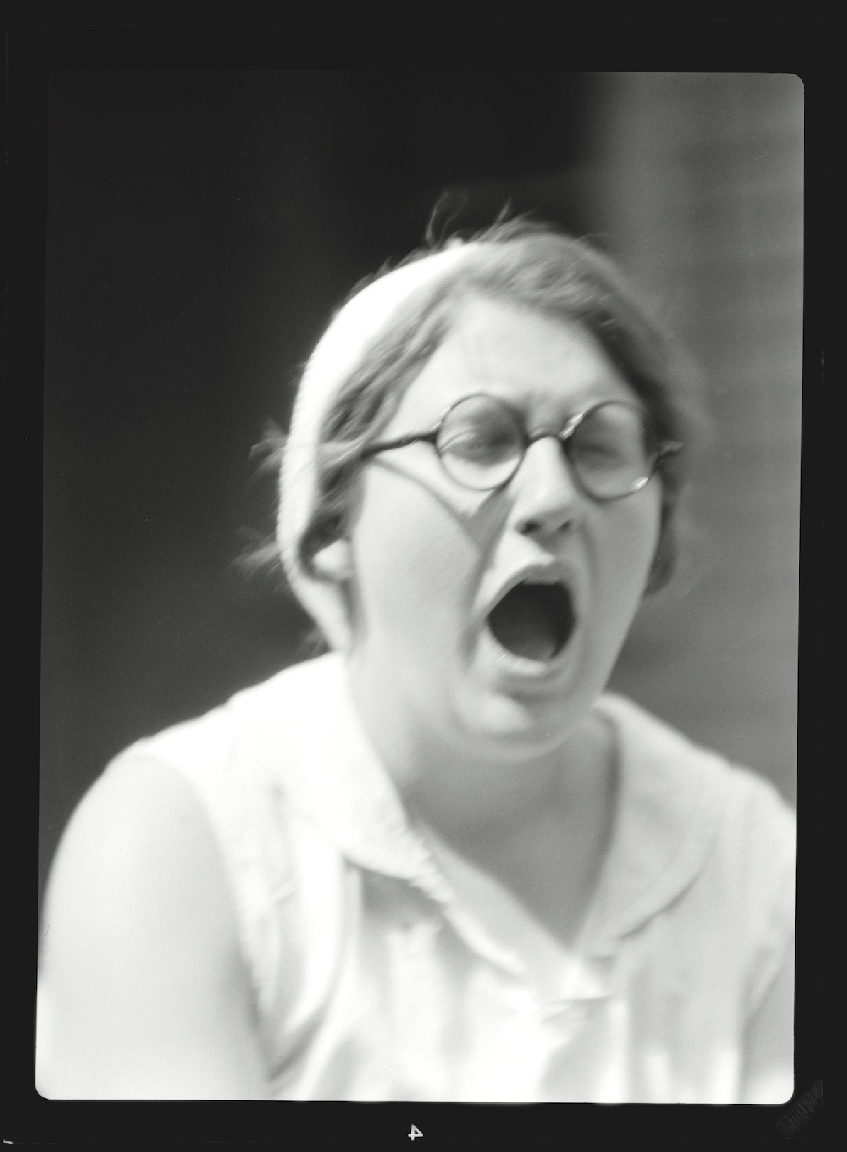 Some of Strout’s photos don’t have easy explanations, such as this one of a woman yawning.
