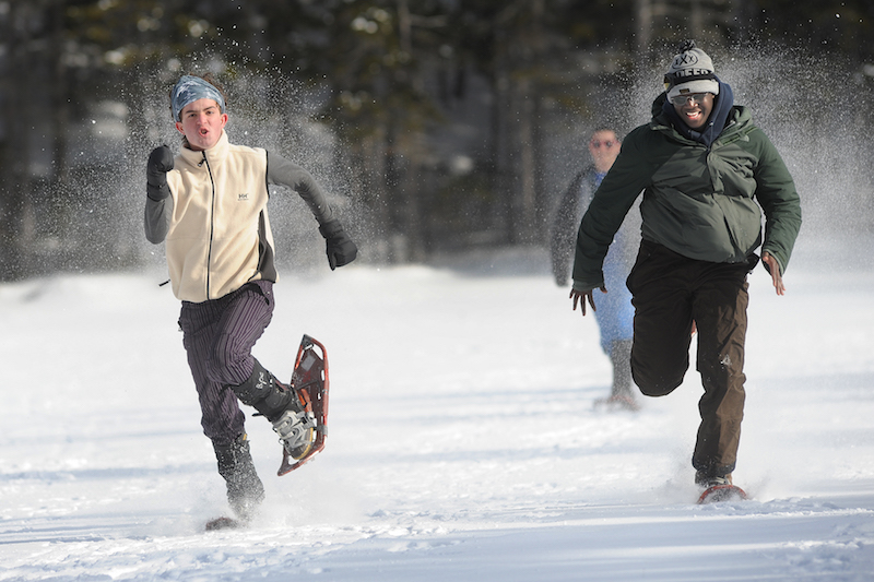 two students snow shoeing