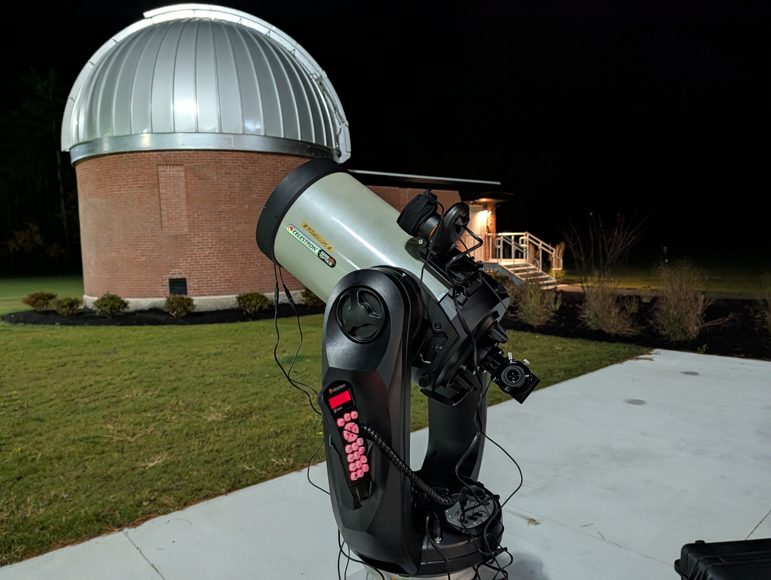 A small telescope outside the observatory on a pier.