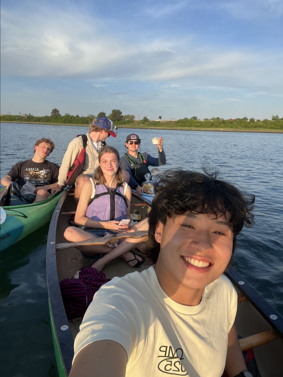 Zai Yang in a canoe with LL Bean interns