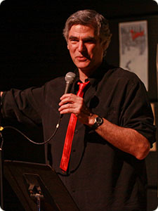 Paul Sarvis holding microphone