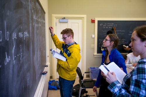 Student Writing on the Board