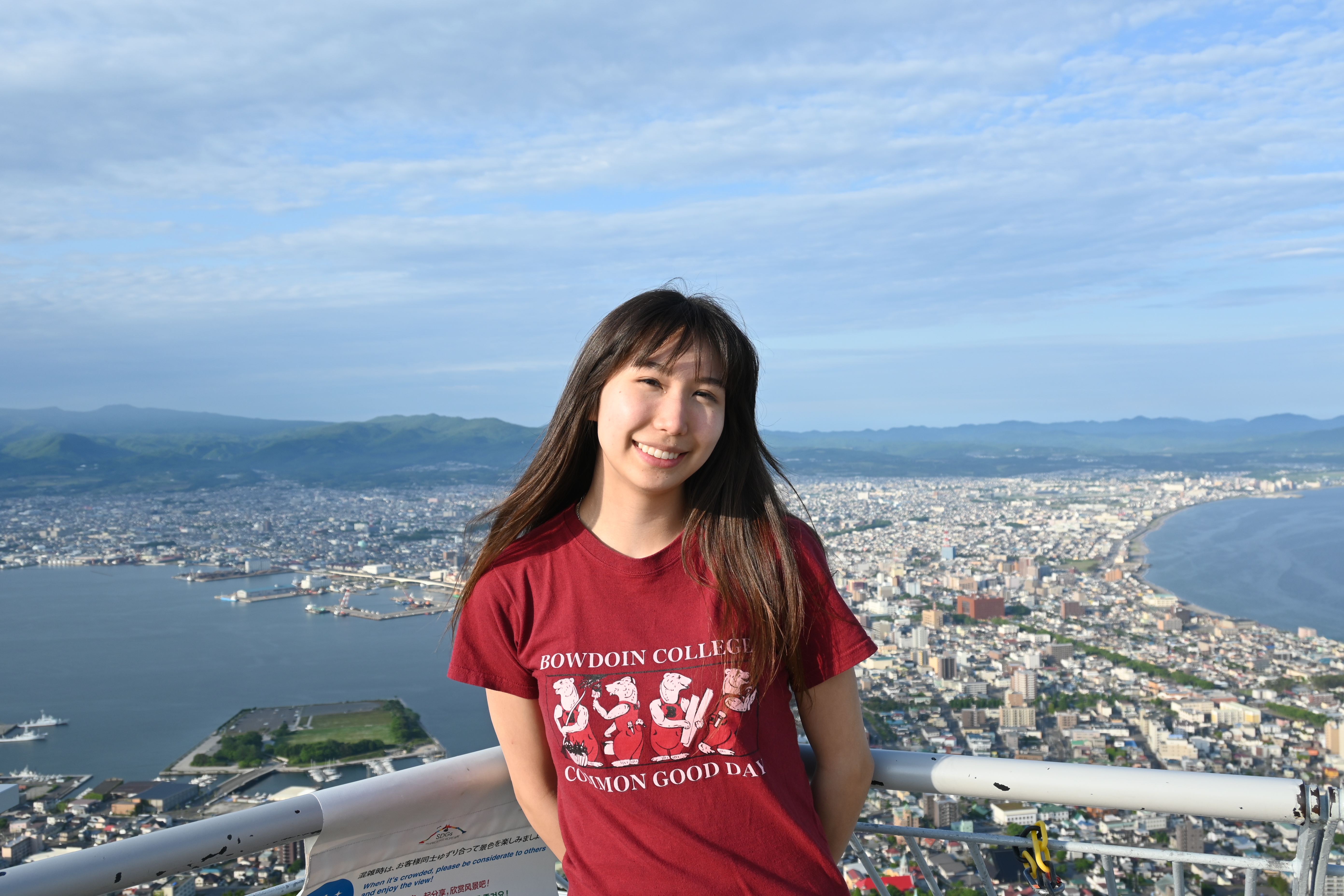 Student stands on top of Mount Hakodate in Japan