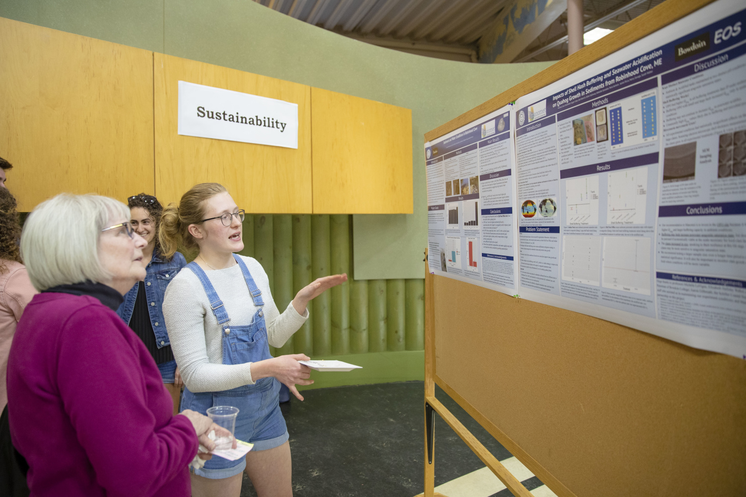 Student showcasing research on Sustainability