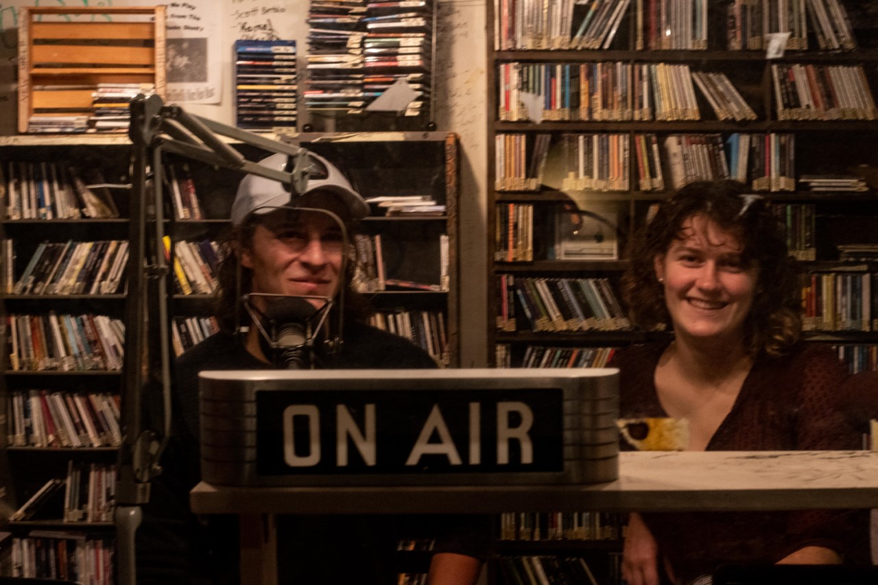 Diego and Marie, in the radio booth recording their first episode