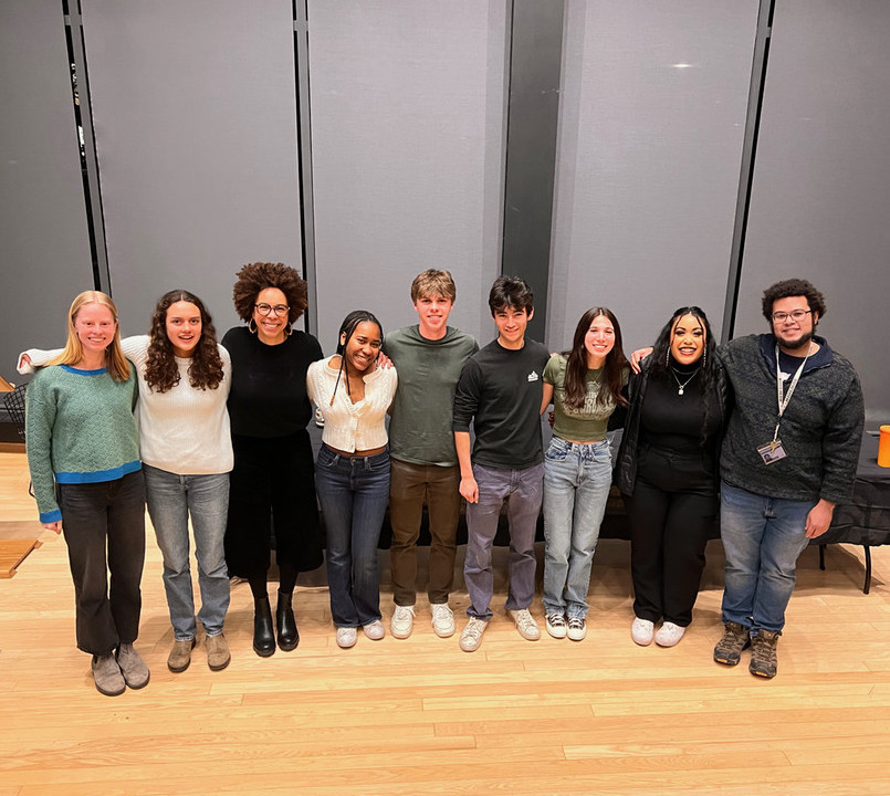 Students standing with environmental justice panelists 2024