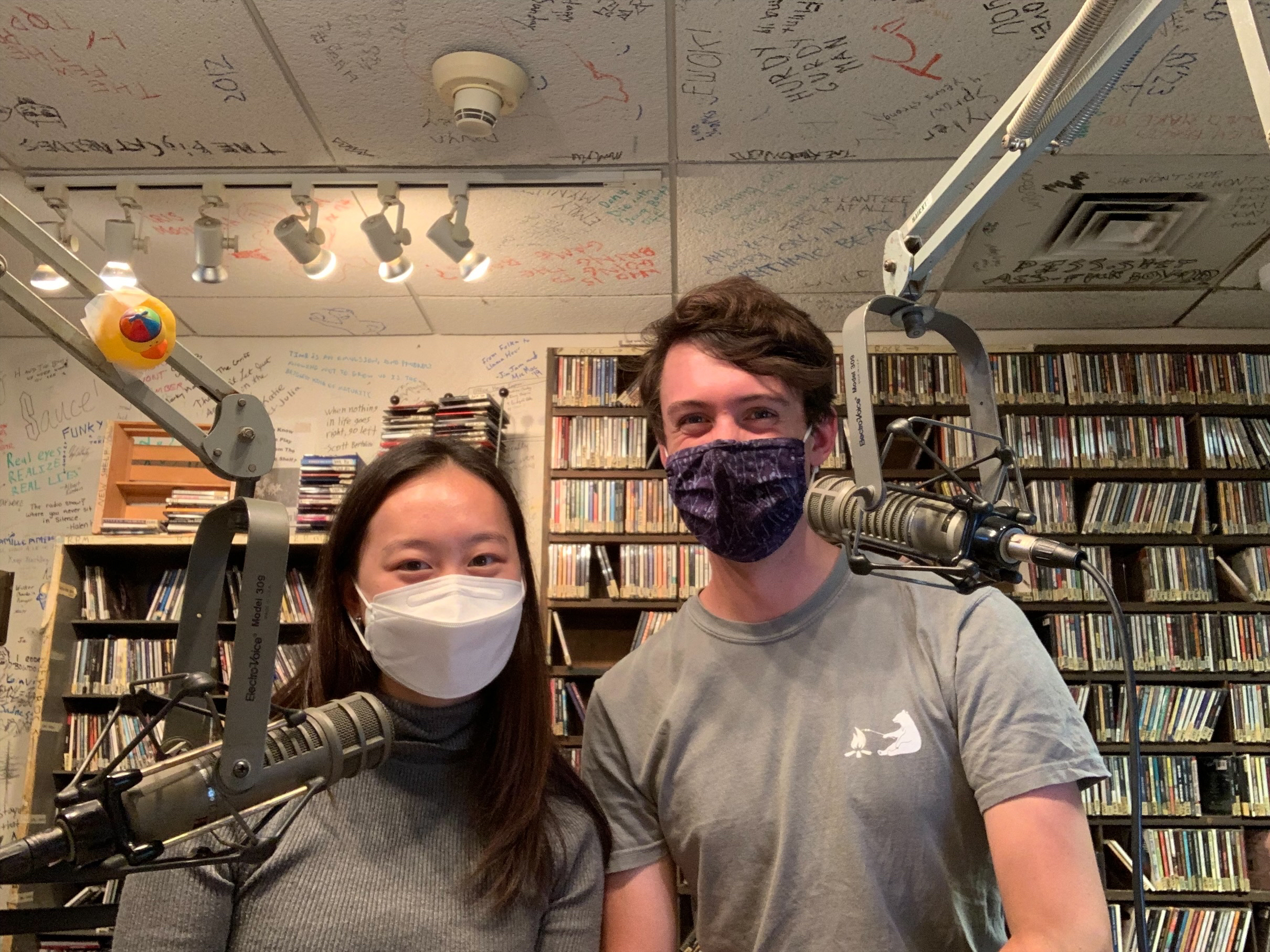 Green Tea hosts Diego and Marie sit behind the mics in the WBOR recording studio