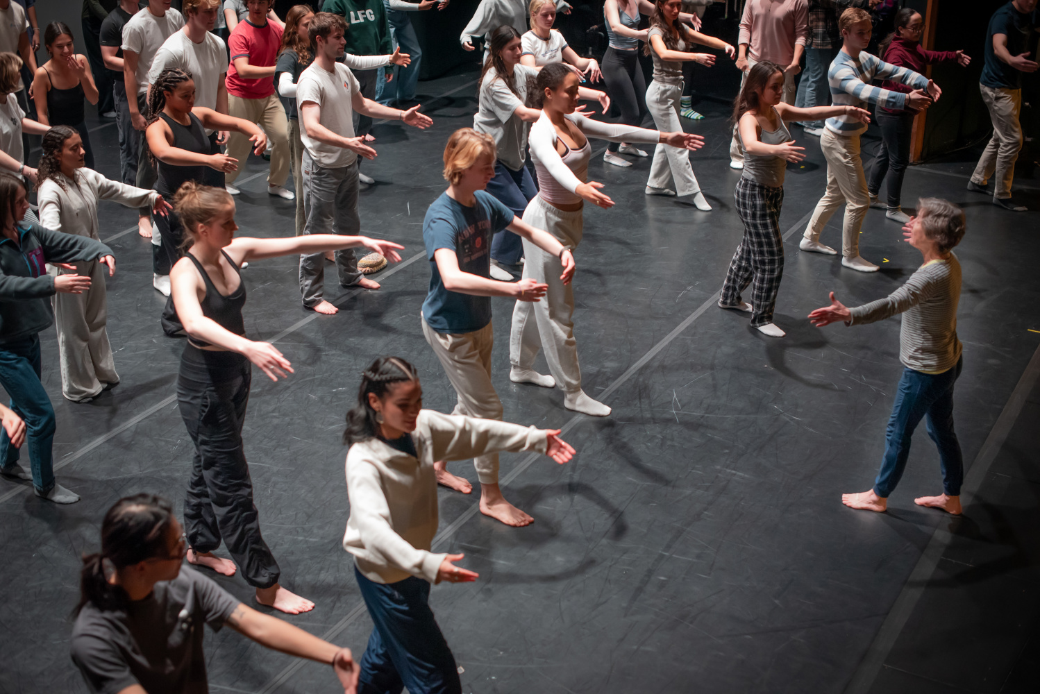 Students practicing dancing with teacher
